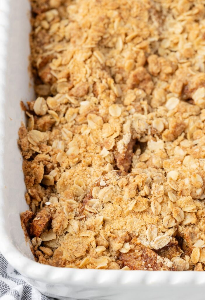 Side view of the baked pear crisp inside the baking pan. 