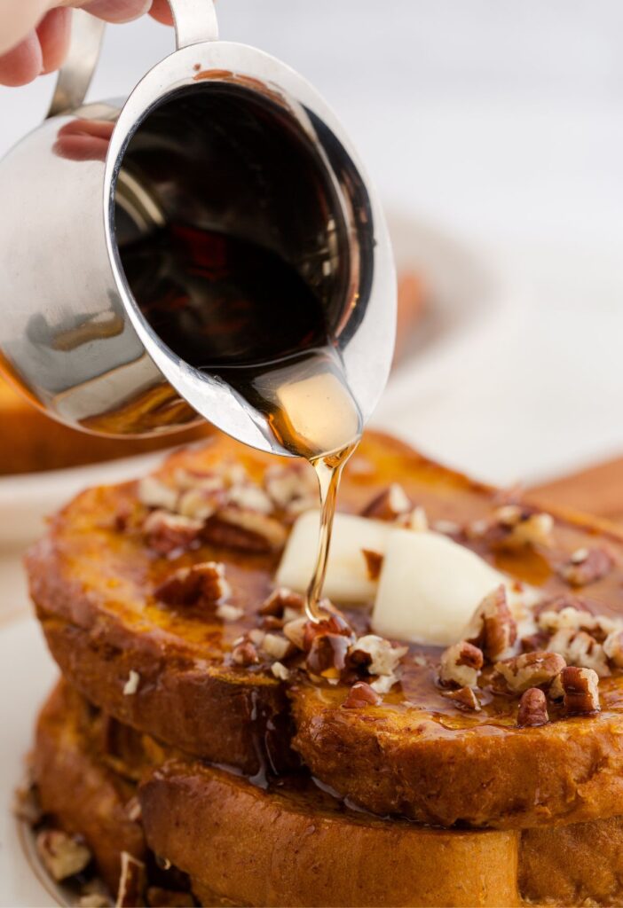 French toast having syrup poured over top of it