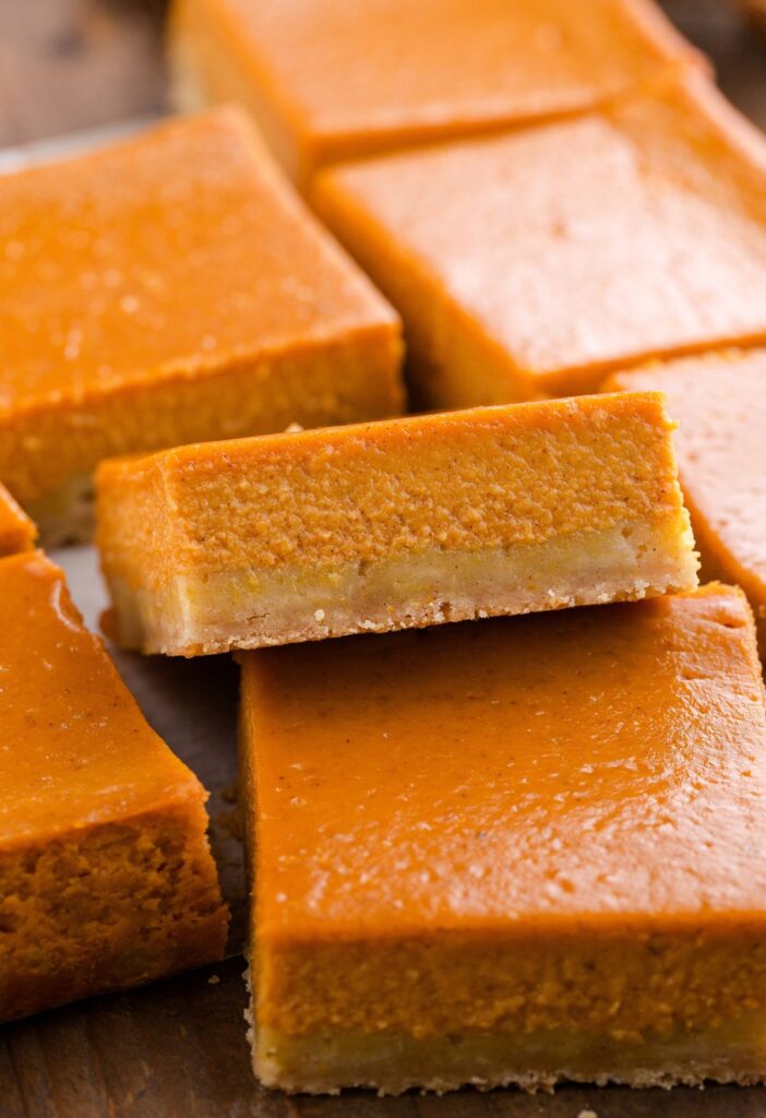 Cooked pumpkin pie bars plain, sliced into squares.