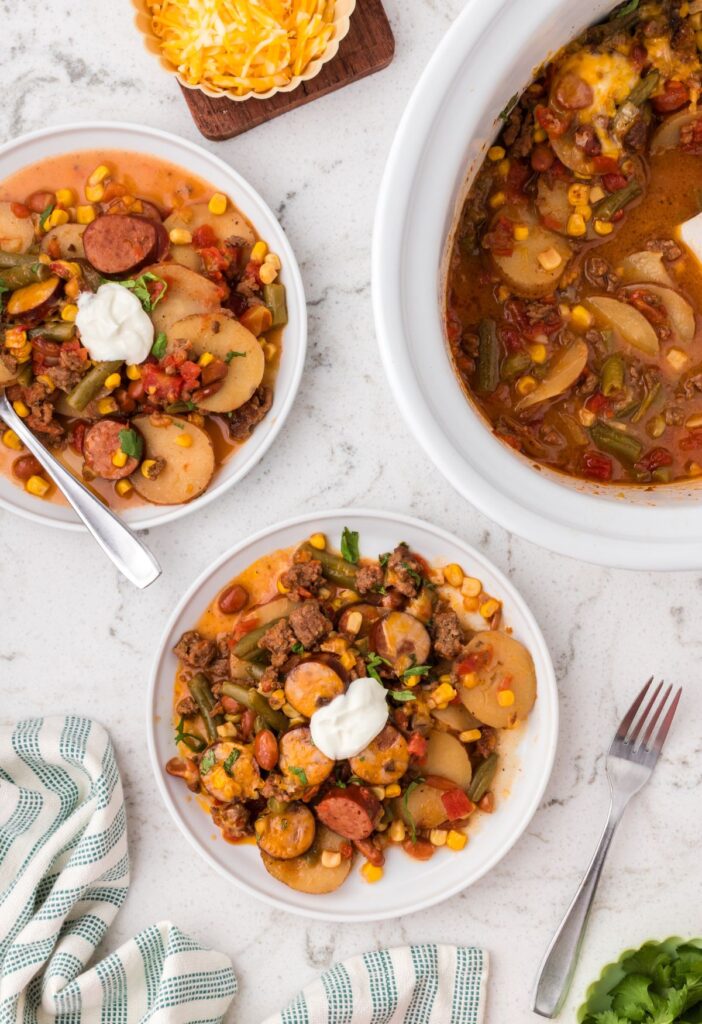Overhead pic of the slow cooker cowboy casserole with a serving plate of some