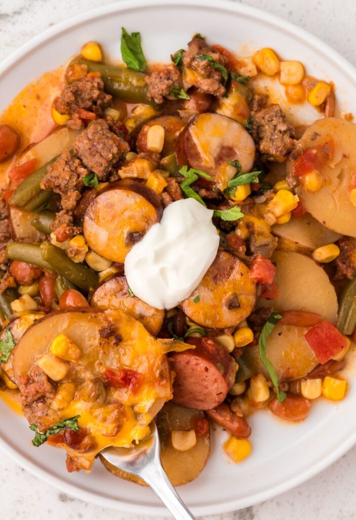 A serving of cowboy casserole with a spoon