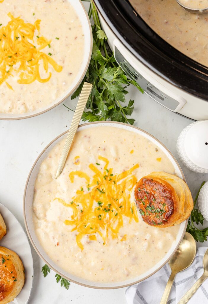 Overhead pic of the slow cooker with potato soup in it