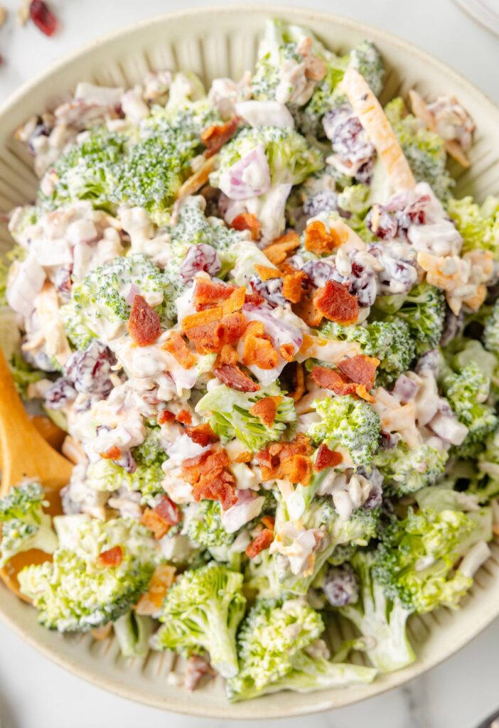 Close up of the bowl with creamy broccoli salad in it. 