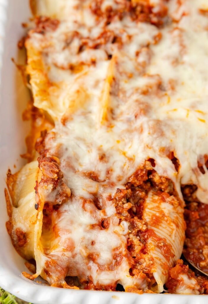 A casserole pan with stuffed shells inside 