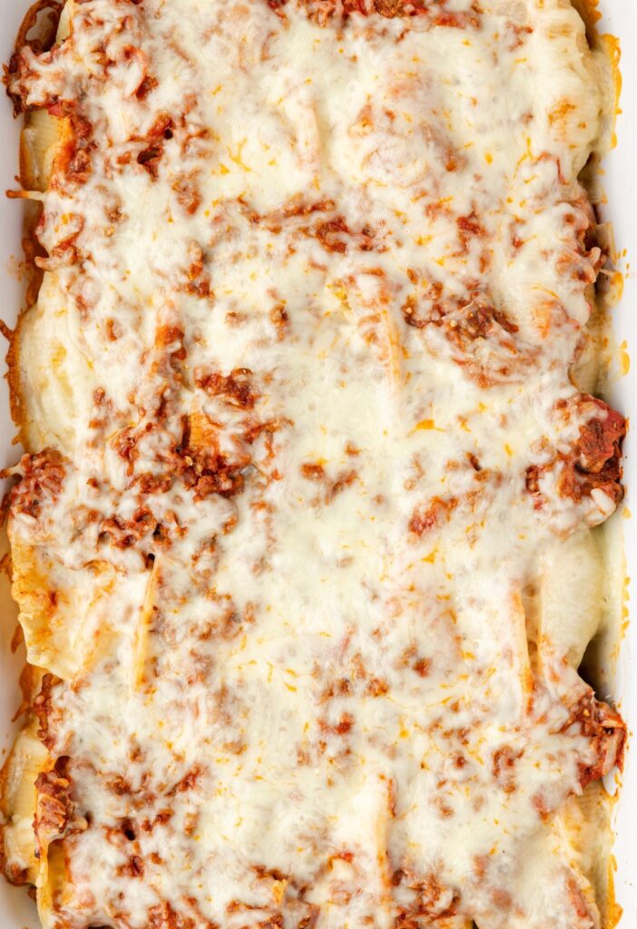 Top of the stuffed shells casserole with melted cheese. 