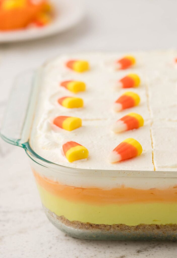 Side view of the glass pan with the layers of the lush dessert visible. 