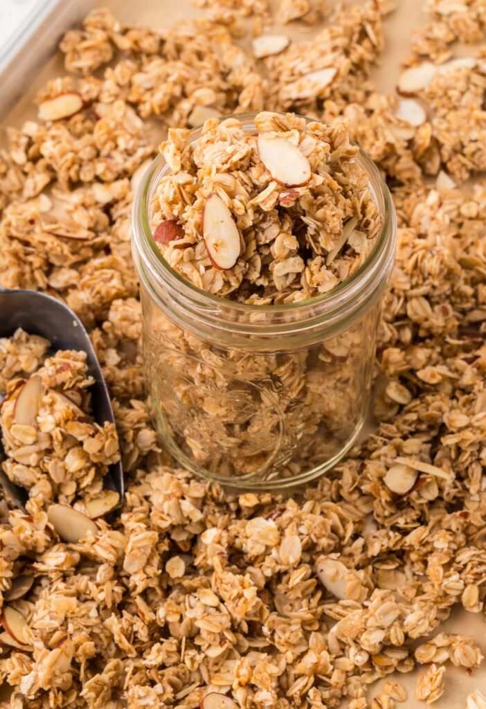 A jar of granola with a scoop