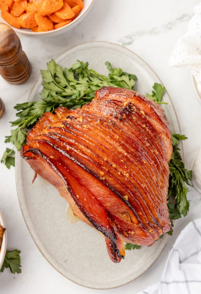 A baked ham on a serving platter
