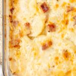 Scalloped potatoes baked with a cheesy topping and ham