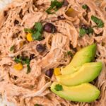 A serving of fiesta chicken with avocado slices on top