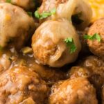 Close up of the meatballs with gruyere cheese