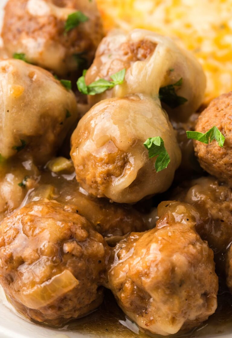 Close up of the meatballs with gruyere cheese
