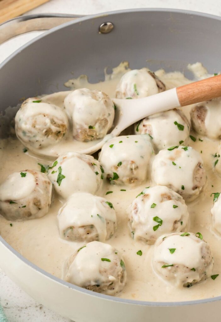Pan of meatballs in Alfredo Sauce