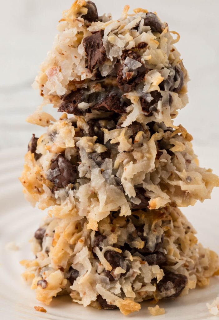 Stack of cookies with a bite taken out of the cookie on top. 