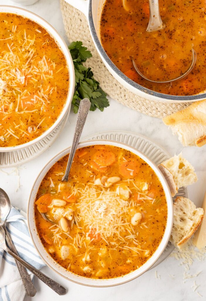 Overhead view of the soup inside the soup pot and a bowl. 