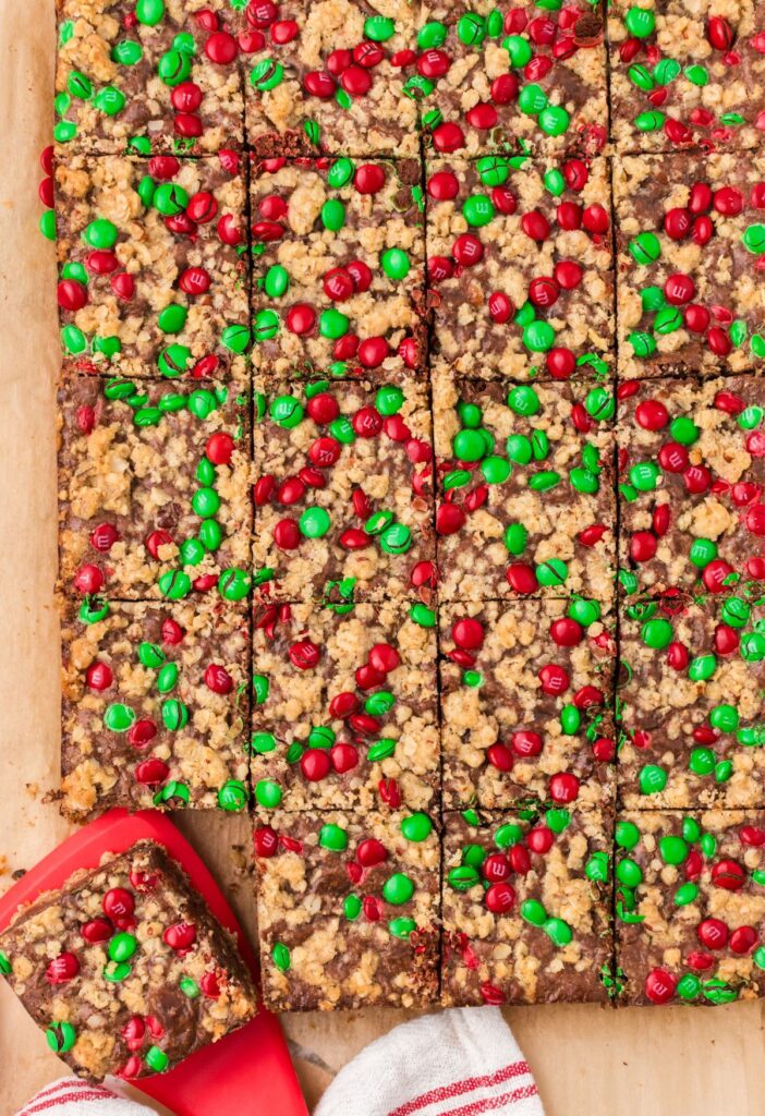 Sliced goody bars with a red spatula for serving