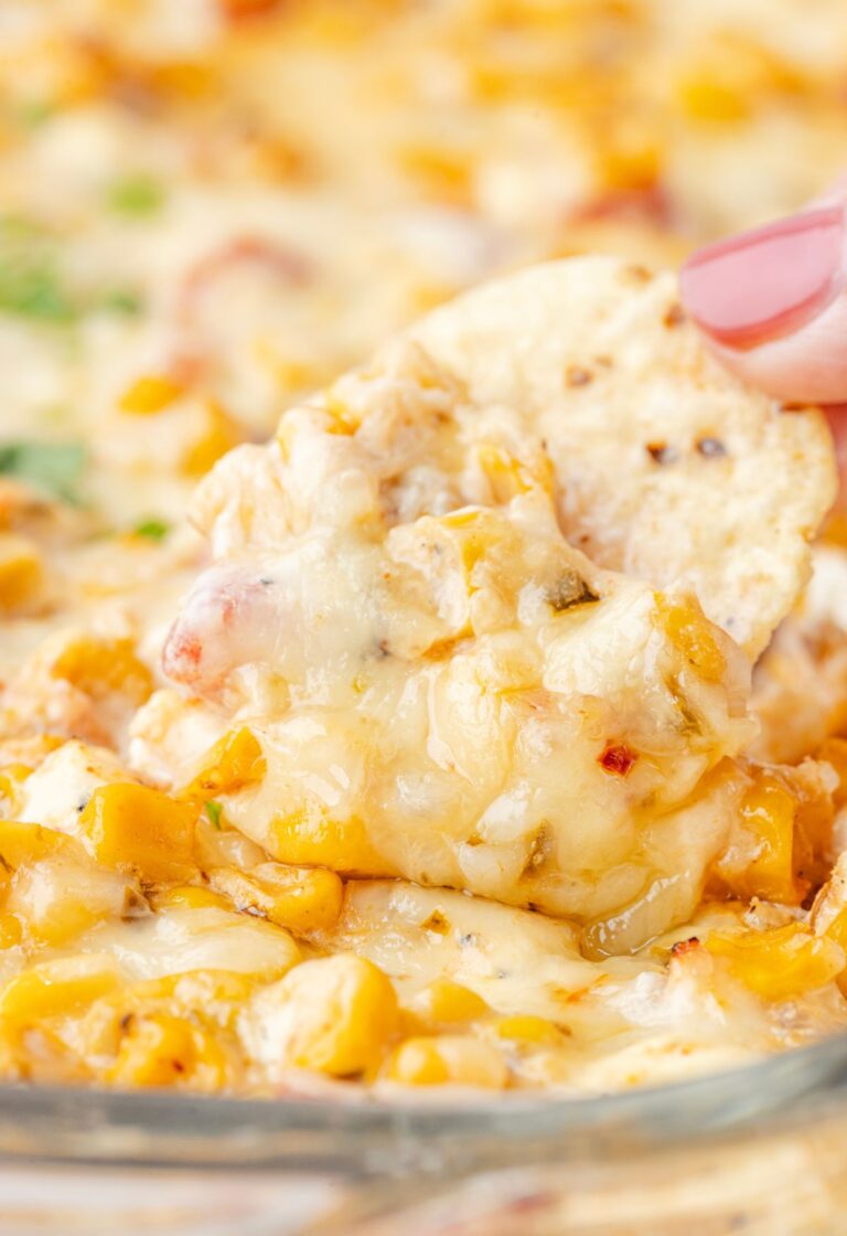 A chip being dipped into the corn dip