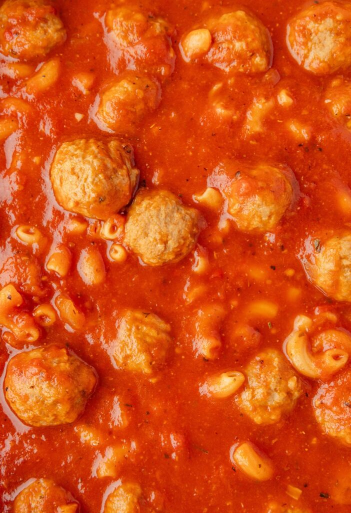 Hero shot of the meatball soup with frozen meatballs, crushed tomatoes, and pasta.
