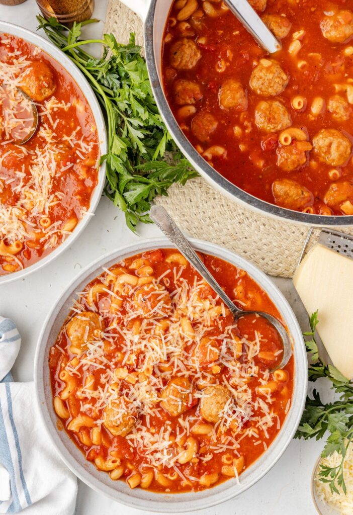Top view of the soup pot and a serving bowl with soup in it. 