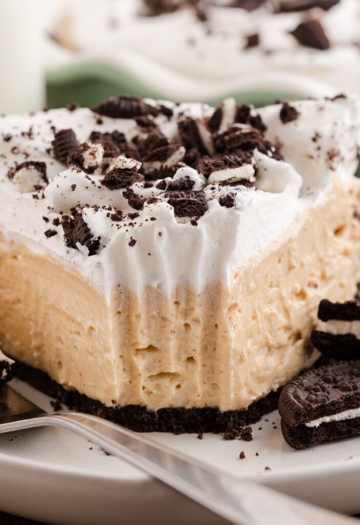 Slice of pie with a fork bite taken out of it