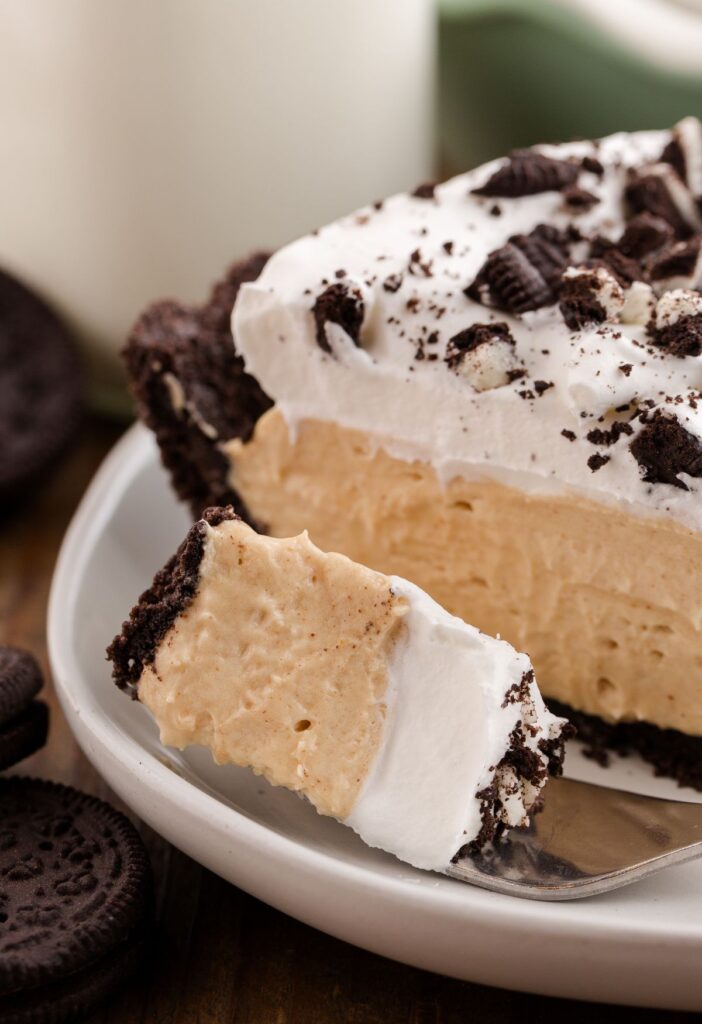 Close up of a bite of the no bake pie with peanut butter and Oreo cookie crust. 