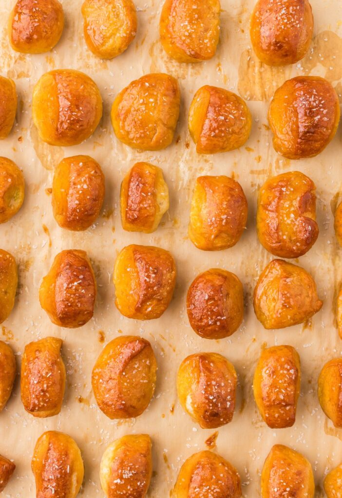 Baked pretzel bites on parchment paper