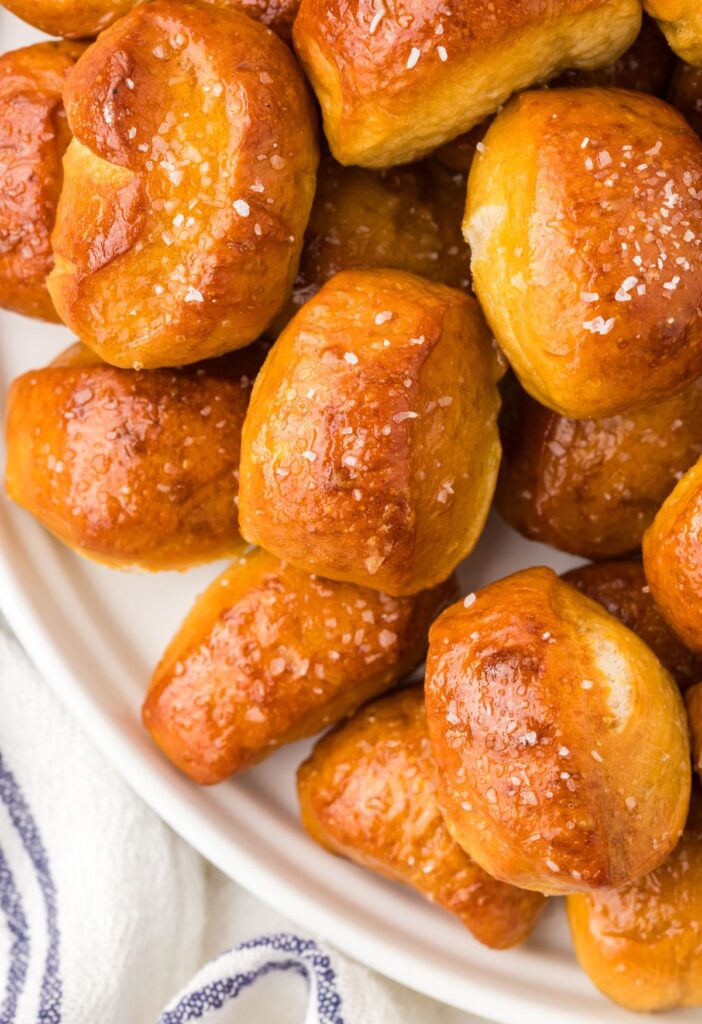 Close up of the pretzel bites on a white plate.