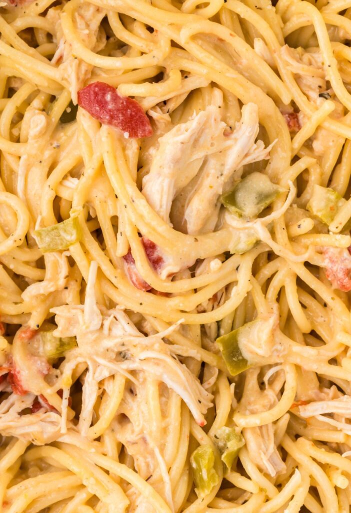 hero shot of the cheesy creamy chicken spaghetti made in the crock pot.