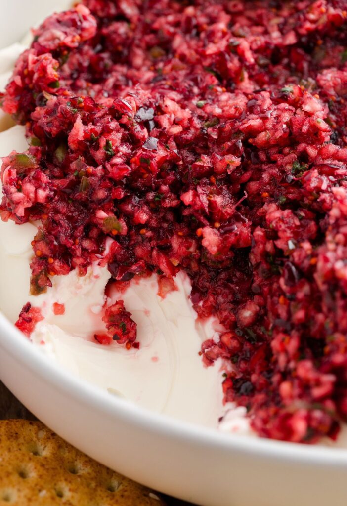 Hero image of the cream cheese dip with cranberries and jalapeno.