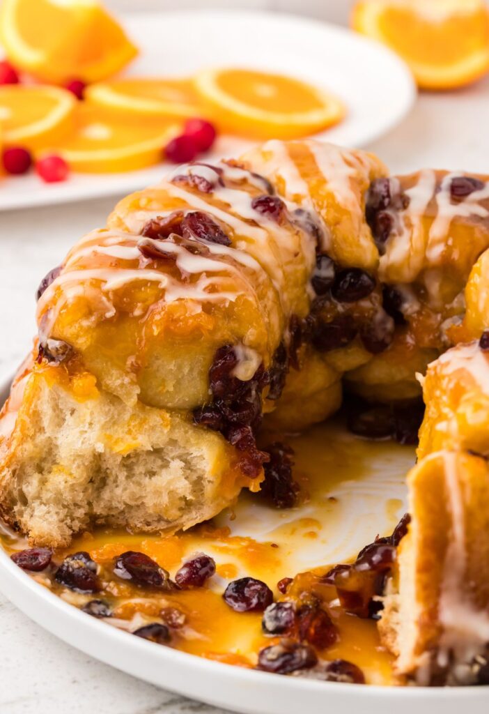 Side view of the eaten monkey bread on a white plate