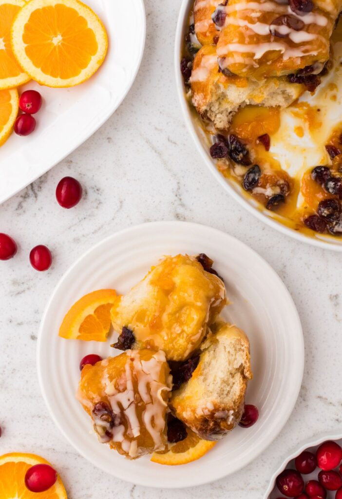 Serving of the monkey bread next to the bundt pan of it. 