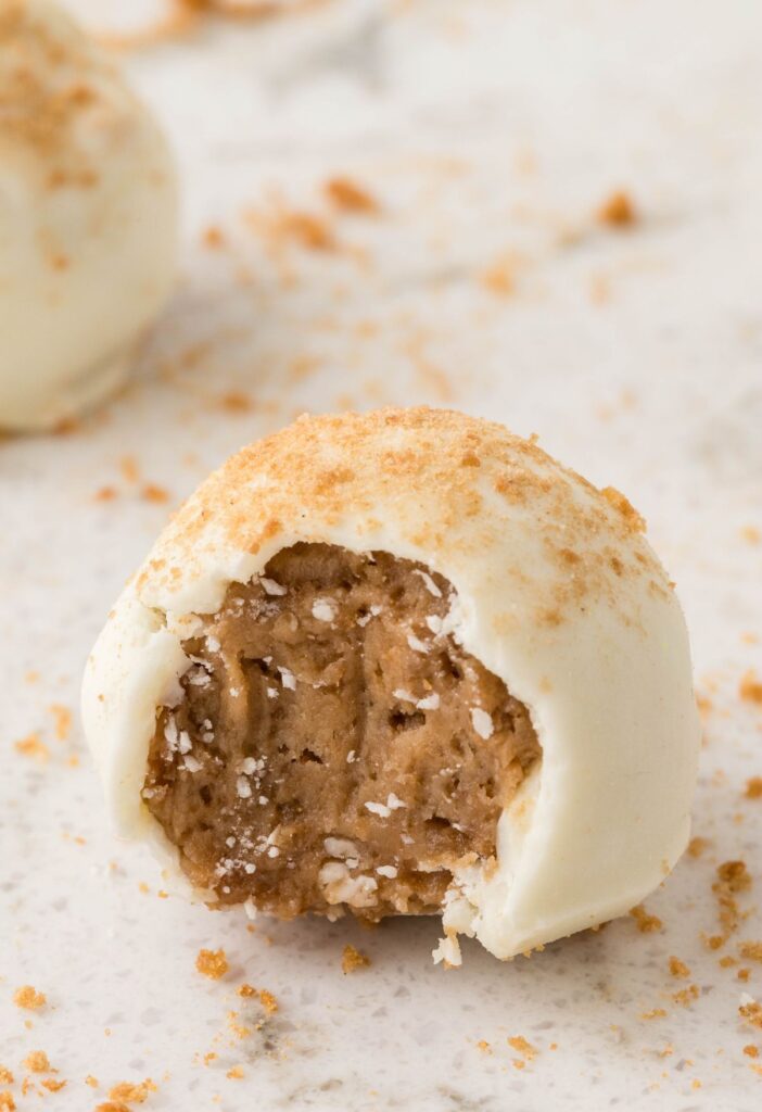 One truffle with a bite taken out of it