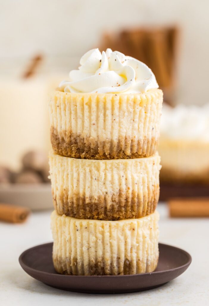 Stack of mini sized cheesecakes with eggnog cheesecake.