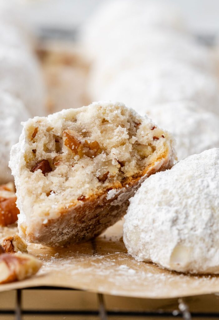 Pecan cookie cut in half sitting on another cookie