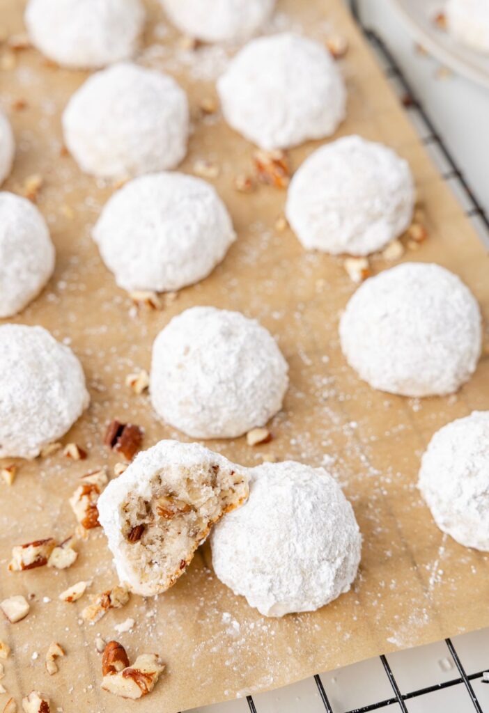 Cooling rack of pecan snowball cookies