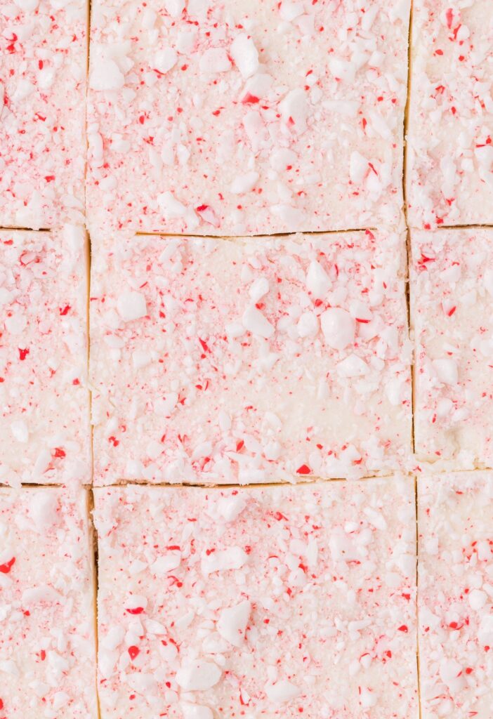 Top view, up close of the candy cane and white chocolate almond bark on top of the Krispie treats. 