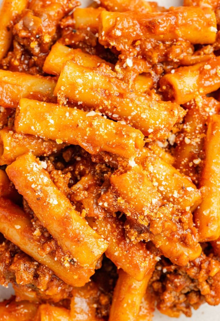 Serving of the beefaroni with parmesan cheese on top.