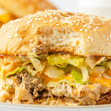 A Big Mac sloppy Joe with a bite taken out of the front.