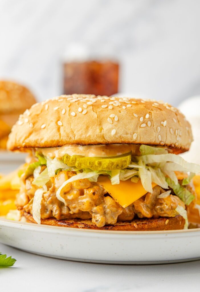 A assembled ready to eat Big Mac sloppy Joe on a plate.