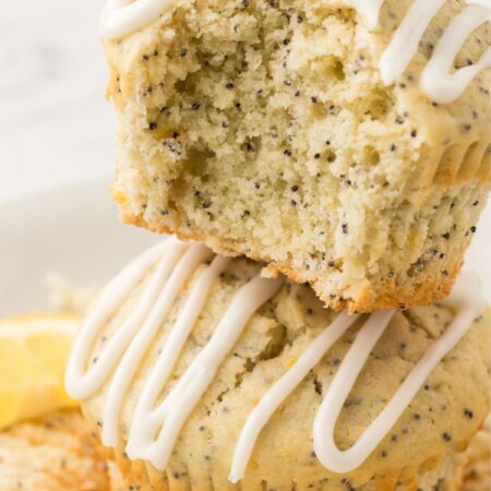 A stack of muffins with a bite taken out of it