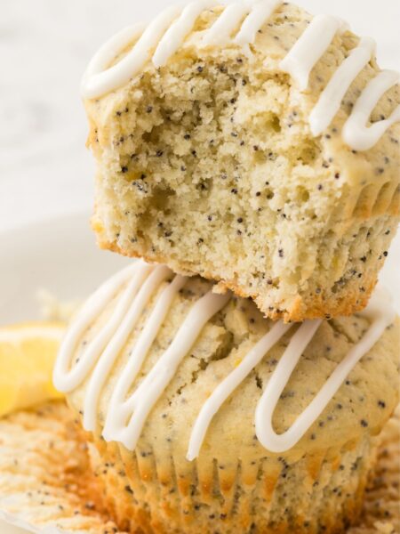 A stack of muffins with a bite taken out of it