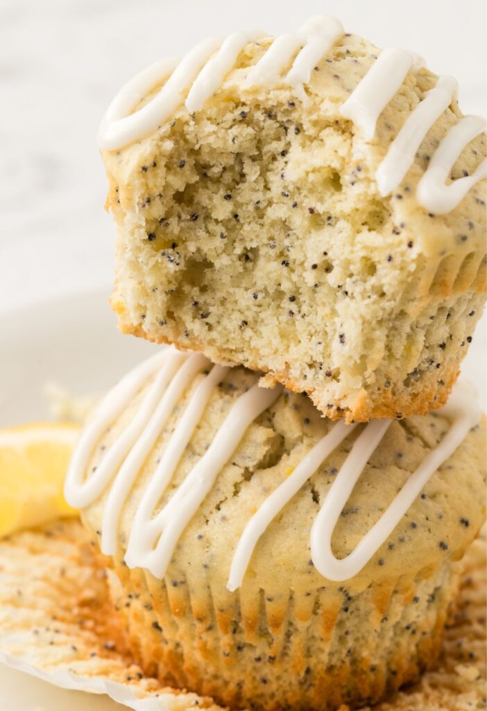 A stack of muffins with a bite taken out of it