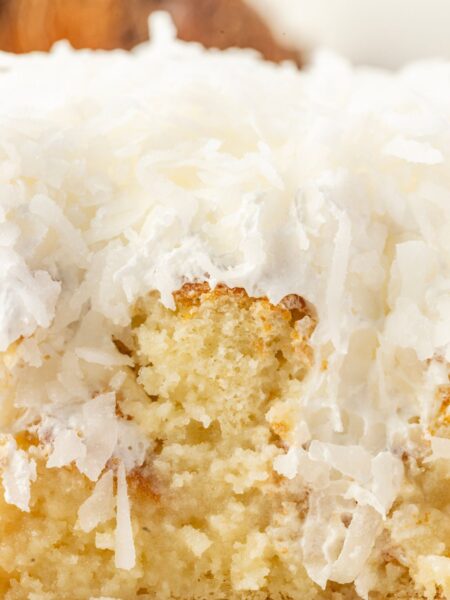 A slice of the poke cake so you can see the coconut cream poke filling.