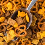 A scoop inside the savory snack mix