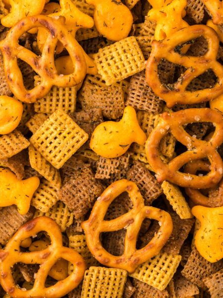 Close up of the chex mix with cereal and crackers.