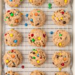 Cooling rack of baked monster cookies with no flour in them.