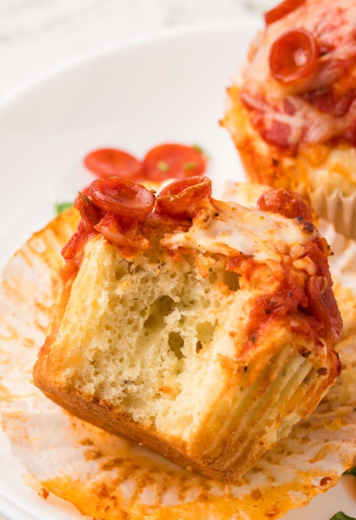 Bite of a pizza muffin