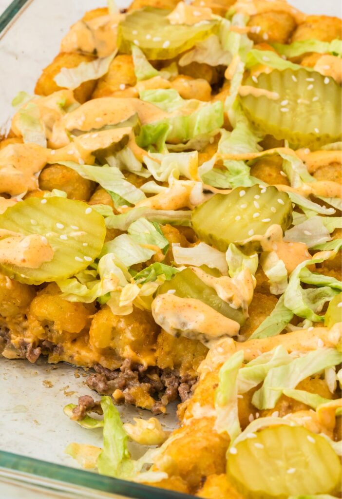Side pic of the tater tot casserole with a piece taken out of it to show the middle.