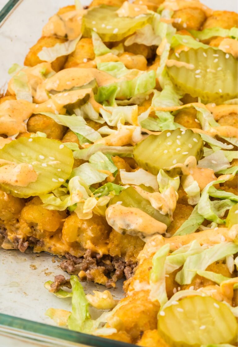 Side pic of the tater tot casserole with a piece taken out of it to show the middle.