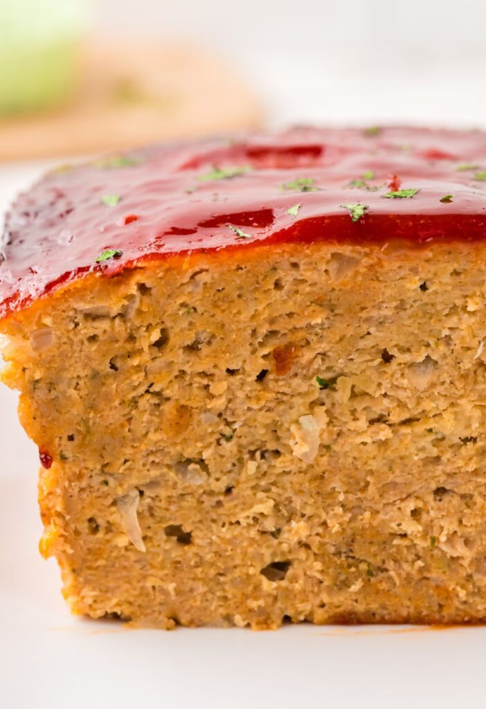 hero image of the front view of the baked meatloaf with a glaze on it.